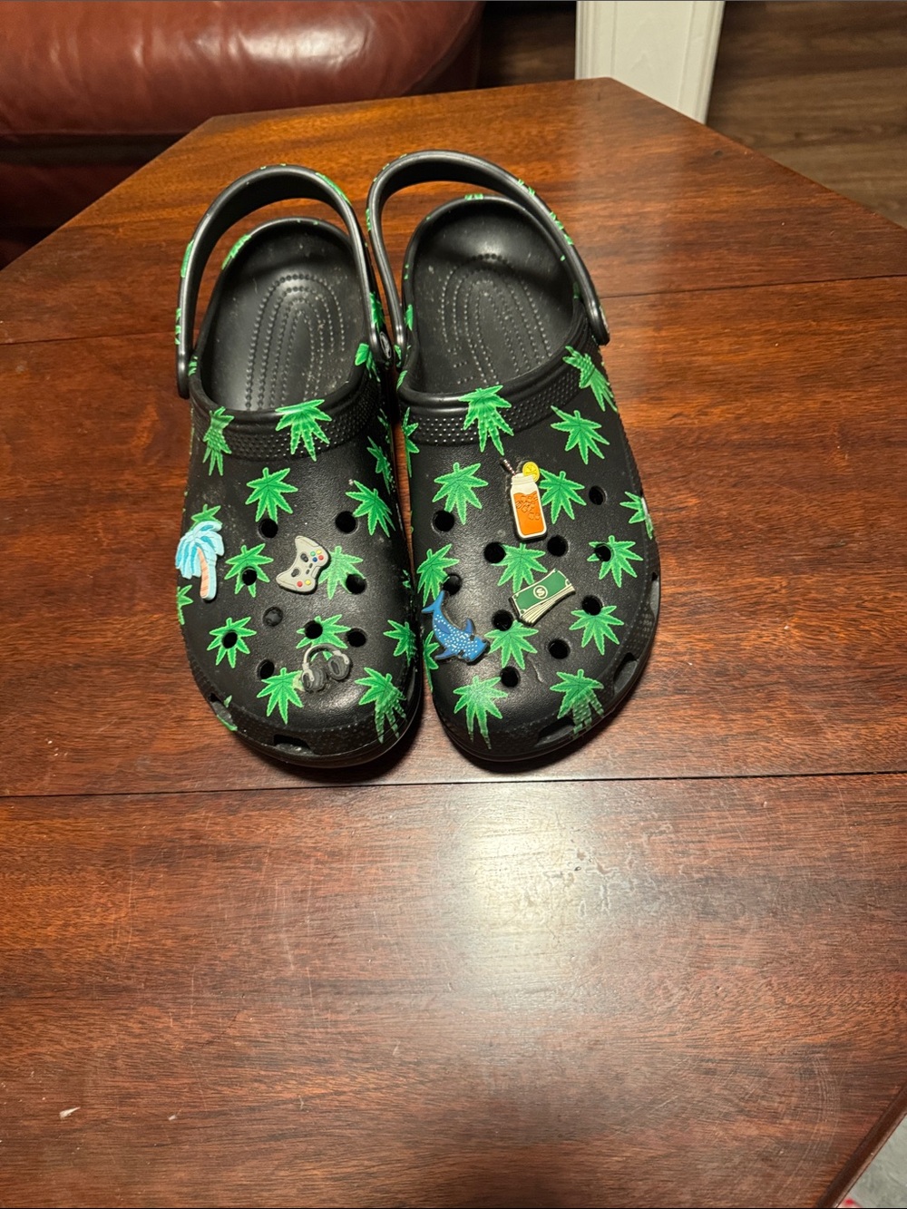 CROCS Kids Black Clogs with Green Leaf Print